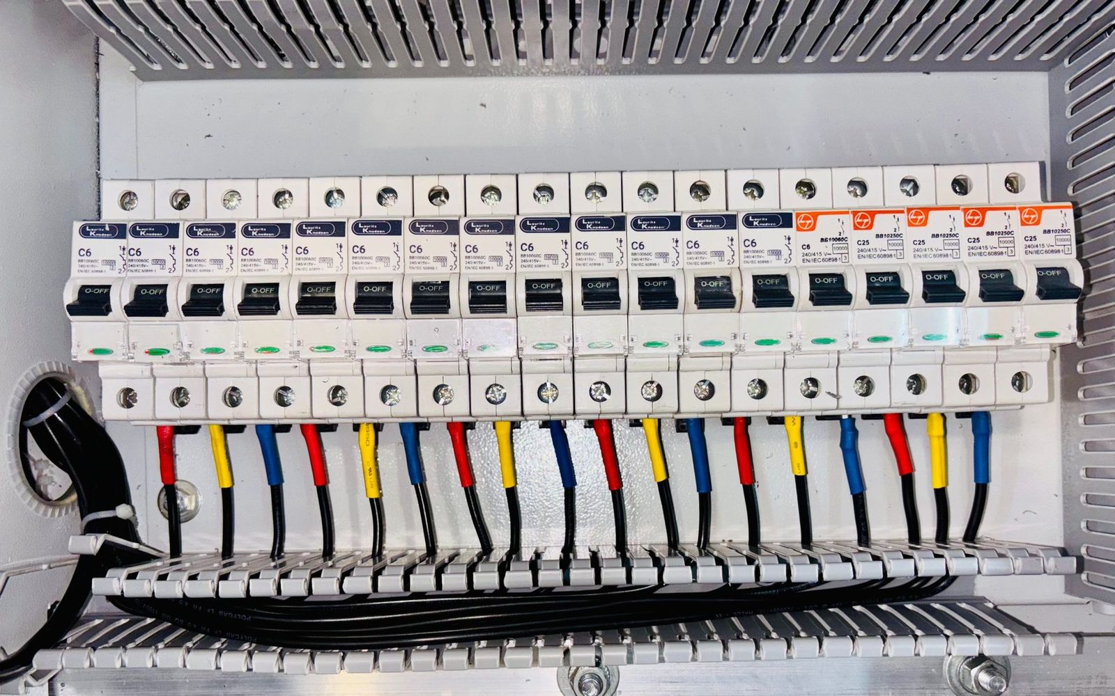 Modern consumer unit with colour-coded circuit breakers
