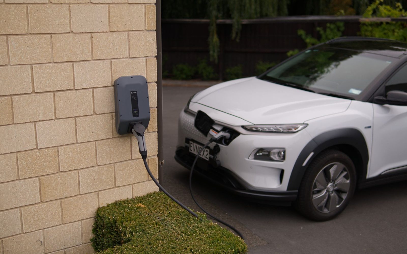 Electric car charging at a home wall charger